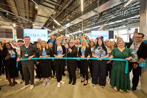 Staff at a ribbon-cutting ceremony for Primark Orlando store